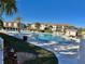 Community pool with surrounding lounge chairs at 175 Kings Hwy # 234, Punta Gorda, FL 33983