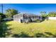 Generous backyard with a screened in enclosure, providing an area for outdoor enjoyment at 18497 Kuldin Ave, Port Charlotte, FL 33948