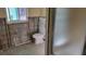 Bathroom renovation: A toilet and shower are present in this remodeled bathroom at 1952 Mississippi Ave, Englewood, FL 34224