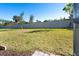 Fenced-in backyard with a large grassy area at 19584 Fishhawk Trl, Venice, FL 34293