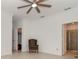Bright bedroom with ceiling fan and access to bathroom and closet at 19584 Fishhawk Trl, Venice, FL 34293