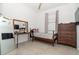 Small bedroom with hardwood floors and built-in shelving at 19584 Fishhawk Trl, Venice, FL 34293