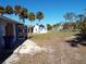 Large backyard with shed and canal view at 228 Bahia Vista Dr, Englewood, FL 34223