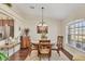 Dining room with round wooden table and four chairs, near kitchen at 229 Medalist Rd, Rotonda West, FL 33947