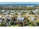 Aerial view showcasing a single-Gathering home, pool, and lush landscaping at 2495 Tenth St, Englewood, FL 34224