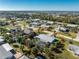 Aerial view of house with pool and tropical landscaping at 2495 Tenth St, Englewood, FL 34224