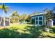 Landscaped backyard with shed and lounge chairs at 2495 Tenth St, Englewood, FL 34224