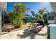 Large backyard with shed, picnic table, and lush landscaping at 2495 Tenth St, Englewood, FL 34224
