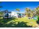 Large backyard with lush landscaping and boat storage at 2495 Tenth St, Englewood, FL 34224