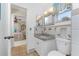 Small bathroom with granite vanity and tiled shower at 2495 Tenth St, Englewood, FL 34224