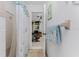 Clean bathroom with shower and glimpse of adjacent room at 2495 Tenth St, Englewood, FL 34224