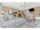 Bright bedroom with a king-size bed and coastal decor at 2495 Tenth St, Englewood, FL 34224