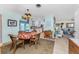 Bright dining area with table, chairs, and view into living room at 2495 Tenth St, Englewood, FL 34224