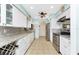 Well-equipped kitchen boasting stainless steel appliances and granite countertops at 2495 Tenth St, Englewood, FL 34224