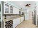 Modern kitchen with white cabinets, granite counters, and stainless steel appliances at 2495 Tenth St, Englewood, FL 34224