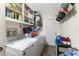 Functional laundry room with washer, dryer, and storage at 2495 Tenth St, Englewood, FL 34224