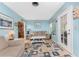 Relaxing living room featuring a comfortable couch and access to outdoor space at 2495 Tenth St, Englewood, FL 34224