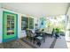 Relaxing screened porch with seating and outdoor access at 2495 Tenth St, Englewood, FL 34224