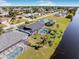 Aerial view of homes along a canal, highlighting waterfront living at 256 Mark Twain Ln, Rotonda West, FL 33947