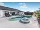 Relaxing pool and spa area with lush landscaping at 256 Mark Twain Ln, Rotonda West, FL 33947