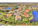 Home with pool and spa, situated on a tranquil lakefront lot at 26852 Faldo Ln, Englewood, FL 34223