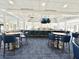 Bright and airy clubhouse bar with a long counter and comfortable seating at 26852 Faldo Ln, Englewood, FL 34223