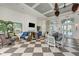 Community clubhouse with comfortable seating areas and a fireplace at 26852 Faldo Ln, Englewood, FL 34223