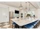 Community clubhouse kitchen with granite island and stainless steel appliances at 26852 Faldo Ln, Englewood, FL 34223