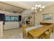 Bright dining room with a view into the living room and kitchen at 26852 Faldo Ln, Englewood, FL 34223
