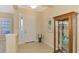 Bright and spacious entryway with decorative display cabinet at 26852 Faldo Ln, Englewood, FL 34223