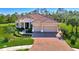 Beautiful one-story home with tile roof, two-car garage, and landscaped yard at 26852 Faldo Ln, Englewood, FL 34223