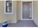 Elegant front door with sidelights and a welcoming entryway at 26852 Faldo Ln, Englewood, FL 34223