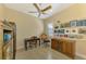Bright home office features built-in shelving, desk, and window with plantation shutters at 26852 Faldo Ln, Englewood, FL 34223