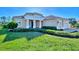 Beautiful one-story home with landscaped yard at 26852 Faldo Ln, Englewood, FL 34223