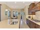 Eat-in kitchen with island, sink, and view to the Gathering room at 26852 Faldo Ln, Englewood, FL 34223