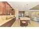 Spacious kitchen with island, stainless steel appliances, and ample cabinetry at 26852 Faldo Ln, Englewood, FL 34223