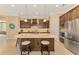 Gourmet kitchen featuring a large island and ample cabinetry at 26852 Faldo Ln, Englewood, FL 34223