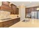 Modern kitchen featuring stainless steel appliances and custom cabinetry at 26852 Faldo Ln, Englewood, FL 34223