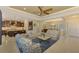 Bright and airy living room with an open kitchen and island at 26852 Faldo Ln, Englewood, FL 34223