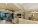Open living room with high ceilings, sliding doors to the pool area at 26852 Faldo Ln, Englewood, FL 34223