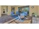 Covered patio with seating area and view of backyard at 26852 Faldo Ln, Englewood, FL 34223