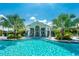 Relaxing resort-style pool with lounge chairs and palm trees at 26852 Faldo Ln, Englewood, FL 34223