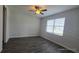 Spacious bedroom with ceiling fan and large window at 30072 Alder Rd, Punta Gorda, FL 33982