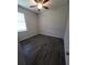 Spacious bedroom with ceiling fan and wood-look tile floor at 30072 Alder Rd, Punta Gorda, FL 33982