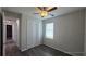 Bedroom with double door closet and wood-look tile floors at 30072 Alder Rd, Punta Gorda, FL 33982