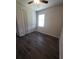 Bedroom with double door closet and wood-look tile floor at 30072 Alder Rd, Punta Gorda, FL 33982