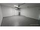 Attached garage with epoxy flooring and storage at 30072 Alder Rd, Punta Gorda, FL 33982