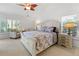 Spacious main bedroom with a king-size bed and ample natural light at 3117 Silkwood Ln, Port Charlotte, FL 33953