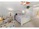 Bright and airy bedroom with a comfortable sitting area at 3117 Silkwood Ln, Port Charlotte, FL 33953
