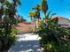 Single story home with tile roof and palm trees at 3117 Silkwood Ln, Port Charlotte, FL 33953